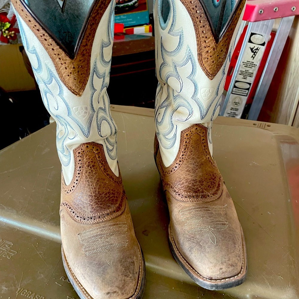 Women’s white and brown Ariat boots.  It has a low heel, worn a few times.